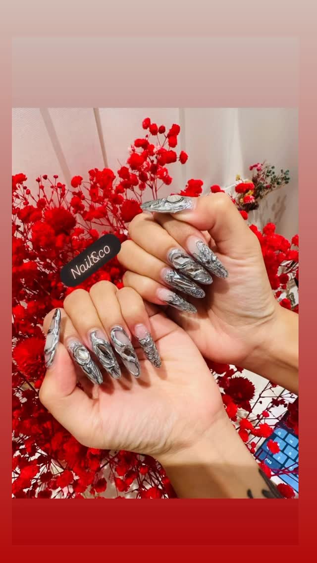 Silver 3D chrome nail art on nude base