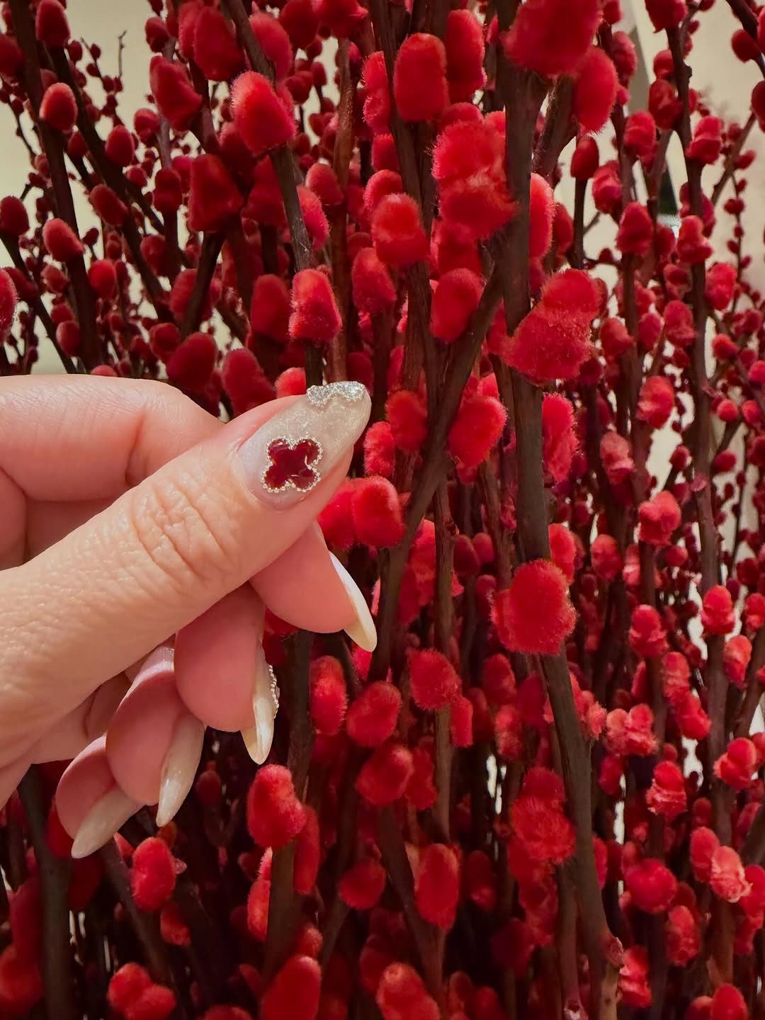 Red four-leaf clover and silver heart jewel nail art